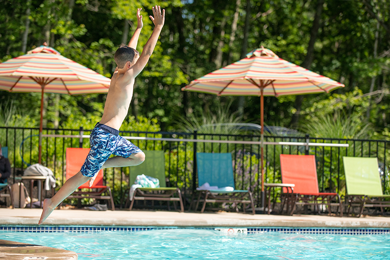 Kid jumping into Saltwater Pool