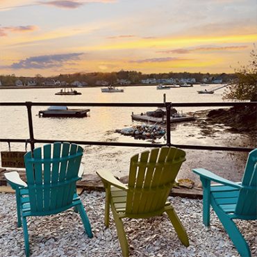 Adirondack chairs overlooking harbor